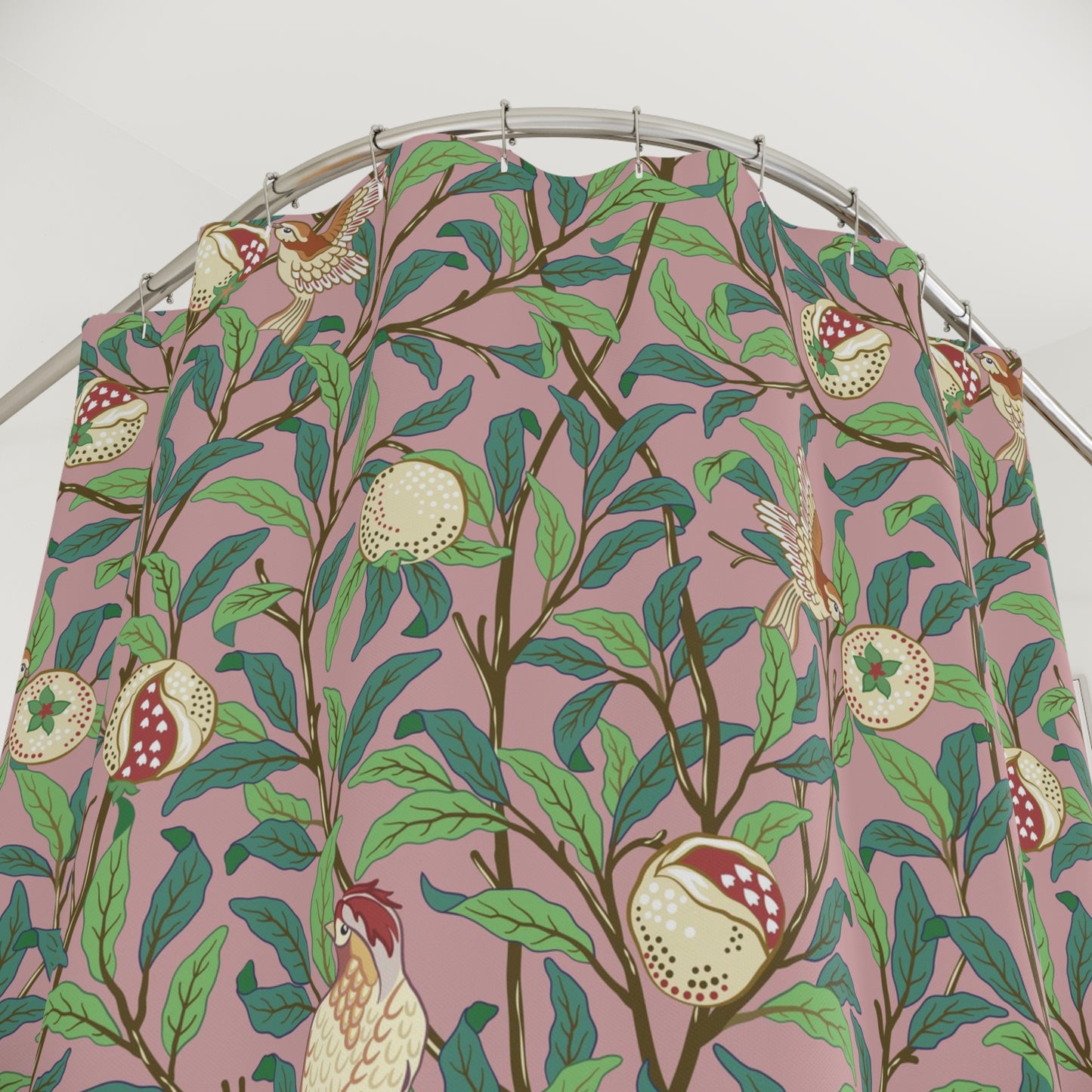 Fabric with a bird and pomegranate pattern on a pink background