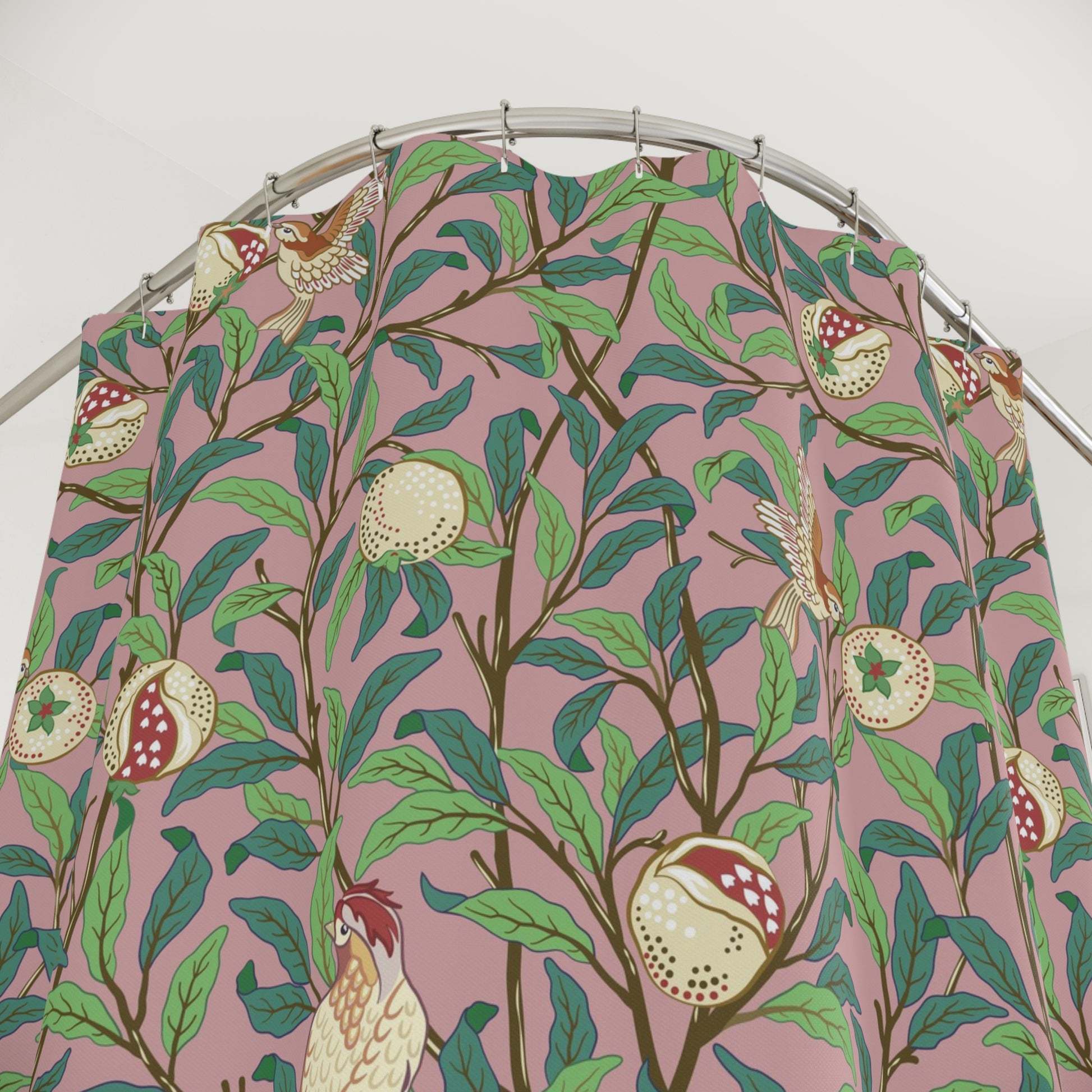 Fabric with a bird and pomegranate pattern on a pink background