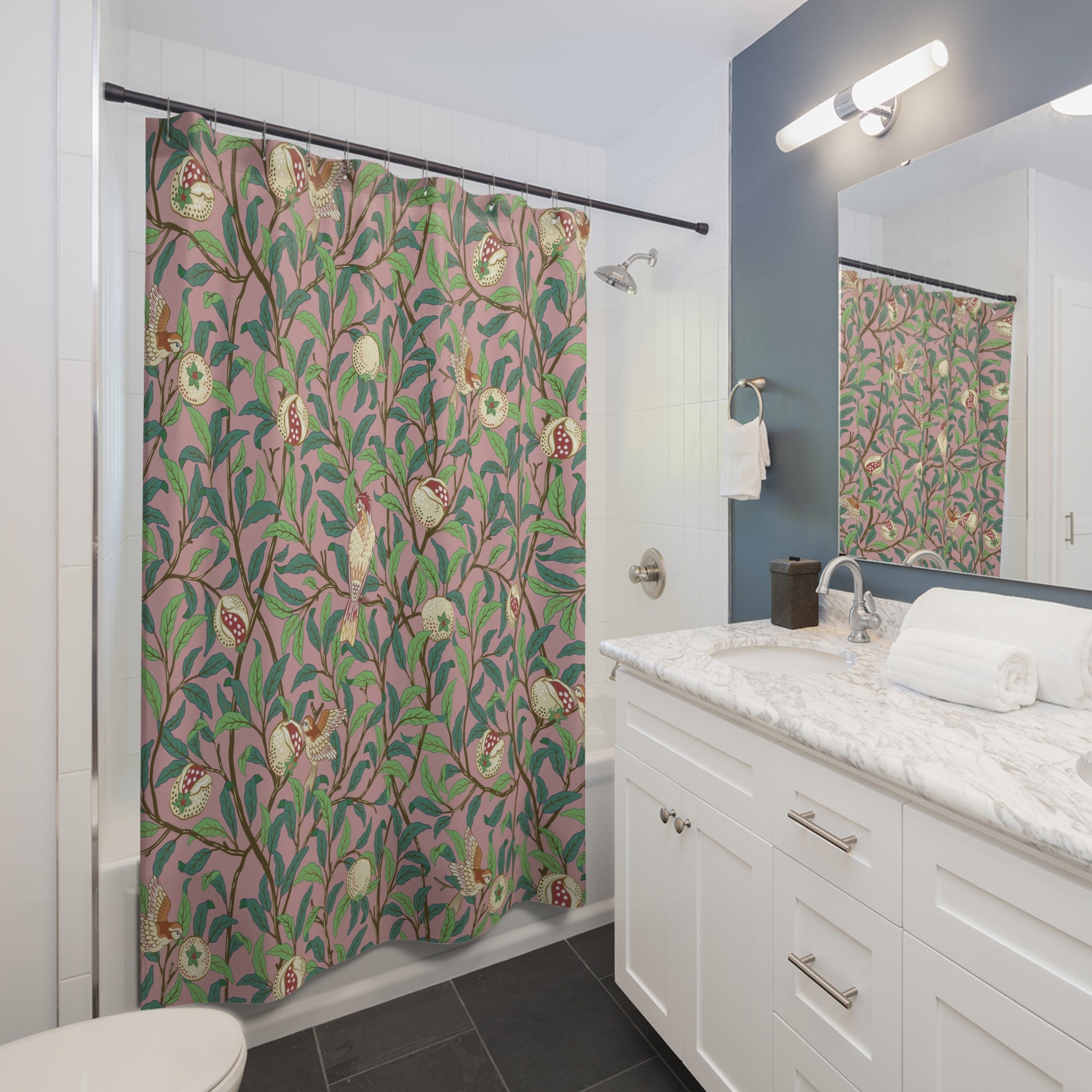 Bathroom with a floral shower curtain, white vanity, and mirror.