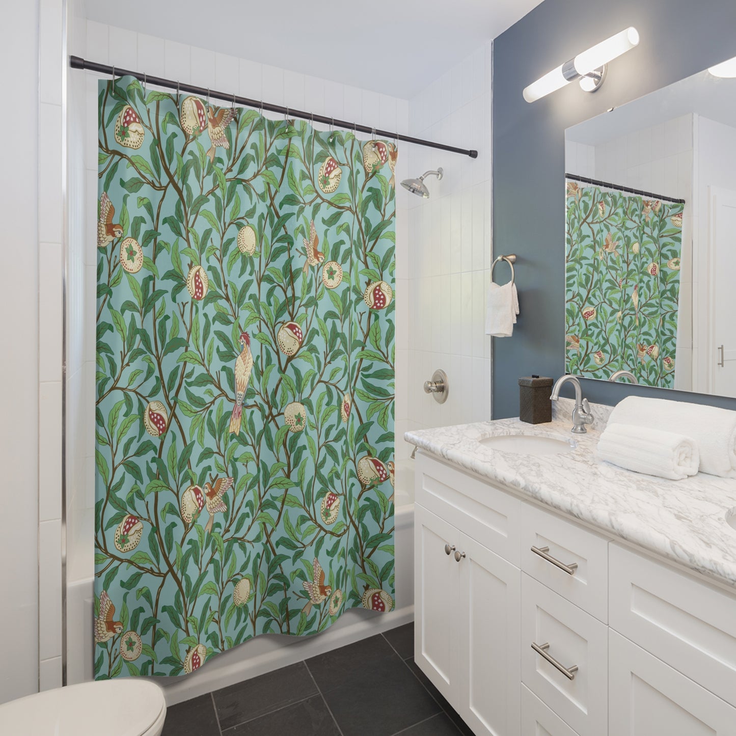 Bathroom with a floral shower curtain, sink, and mirror.