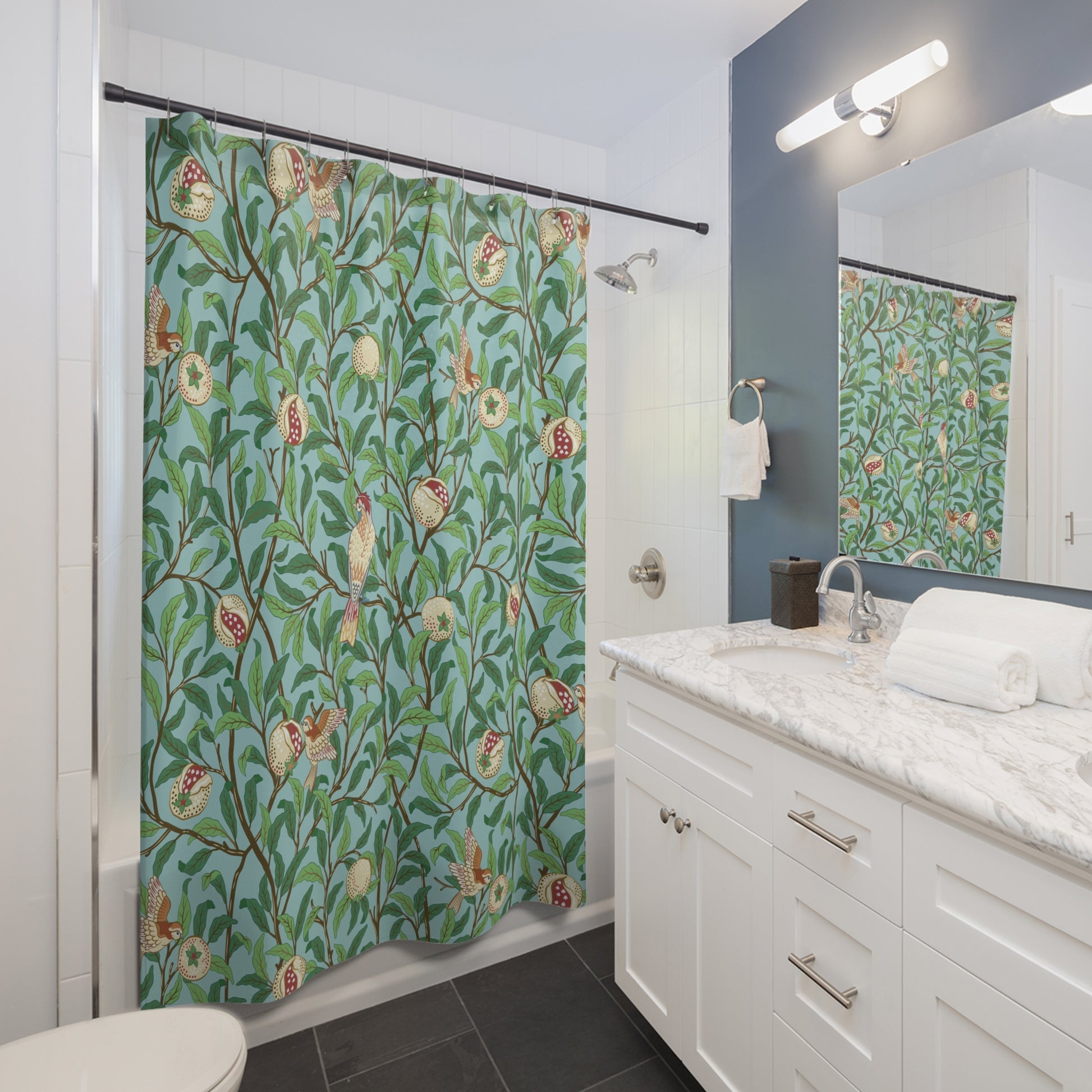 Bathroom with a floral shower curtain, sink, and mirror.
