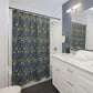 Bathroom with floral shower curtain, white vanity, and mirror.