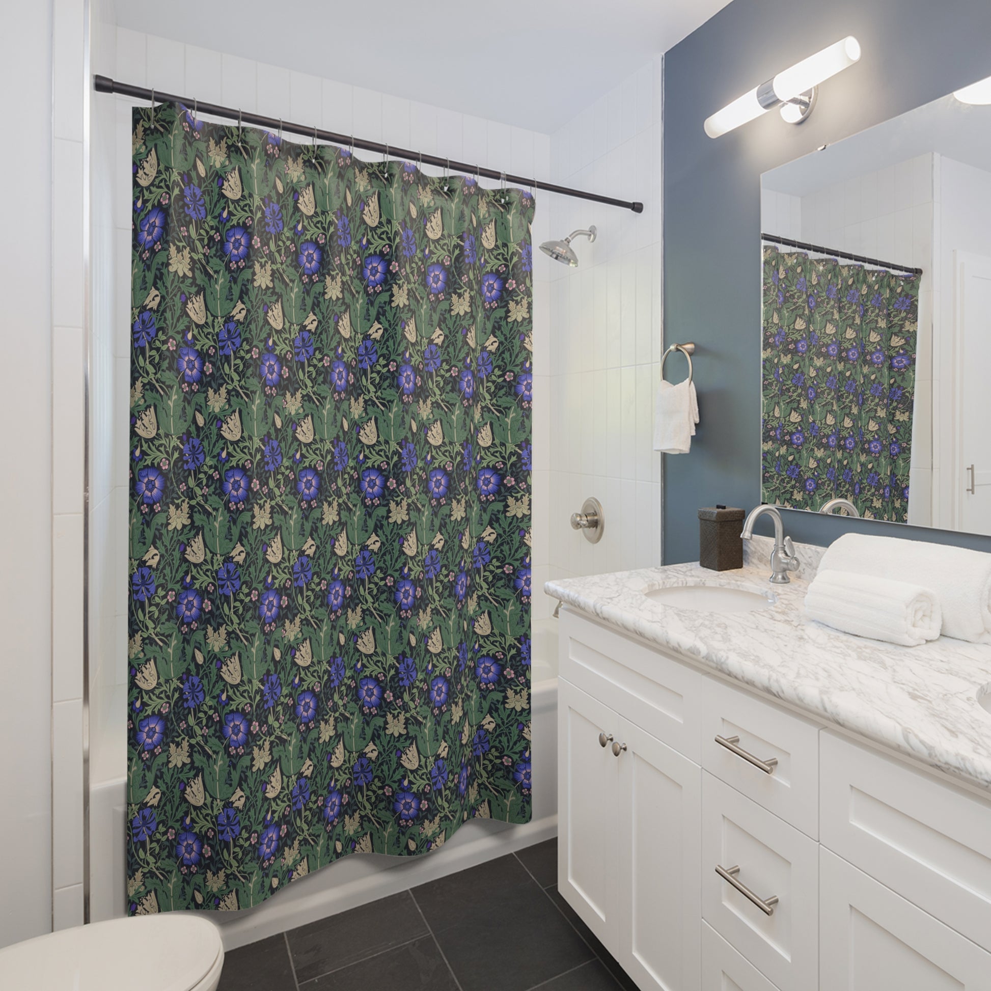 Bathroom with floral shower curtain, white vanity, and mirror.