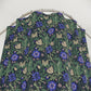 Floral patterned fabric on a hanger against a white background
