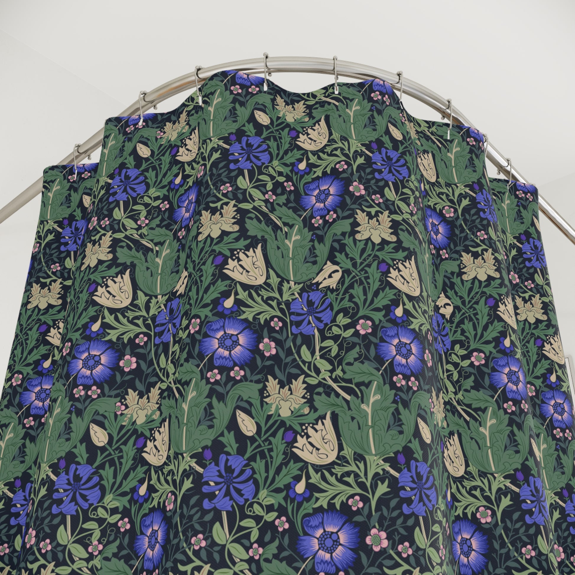 Floral patterned fabric on a hanger against a white background