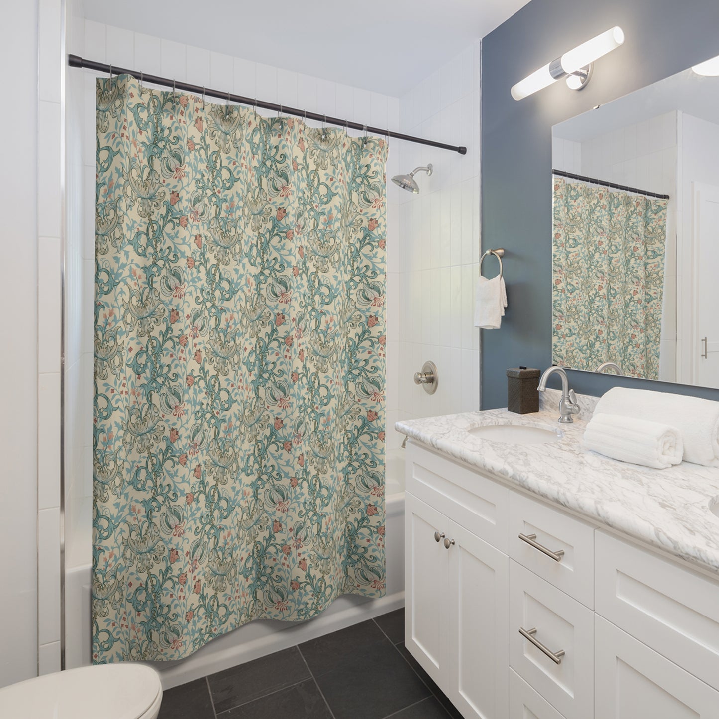 Bathroom with a floral shower curtain, sink, and mirror.