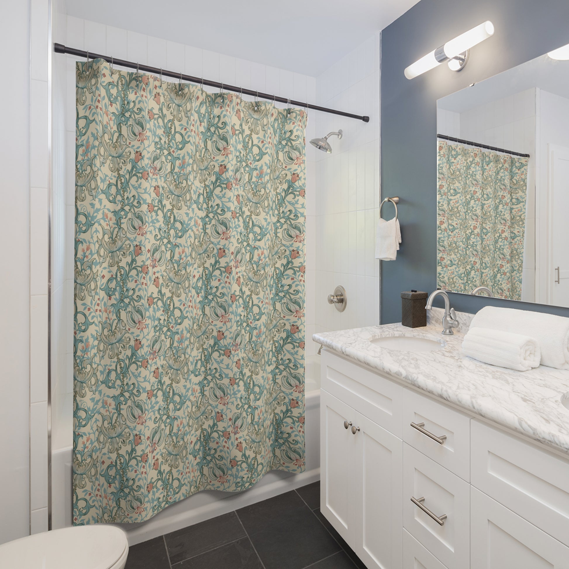 Bathroom with a floral shower curtain, sink, and mirror.