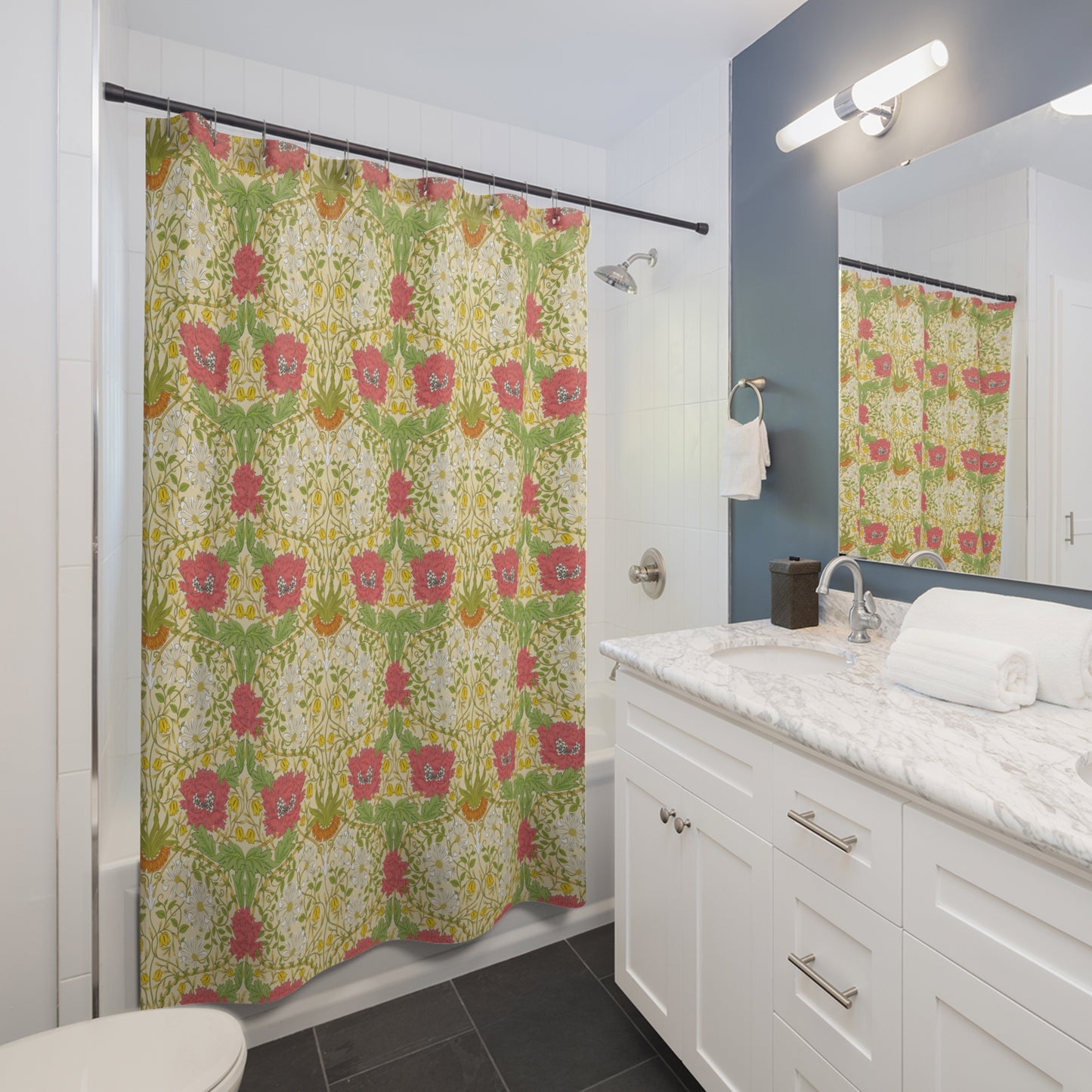 Bathroom with a floral shower curtain, white vanity, and mirror.