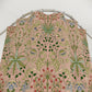 Floral patterned fabric on a metal rod against a white background