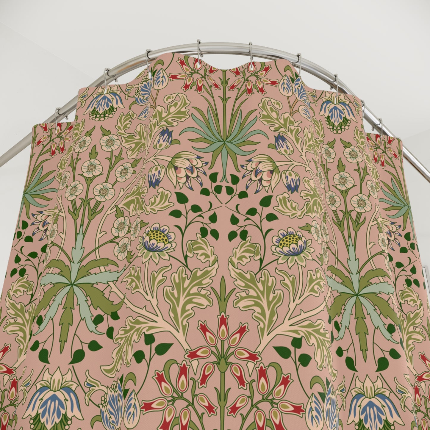 Floral patterned fabric on a metal rod against a white background
