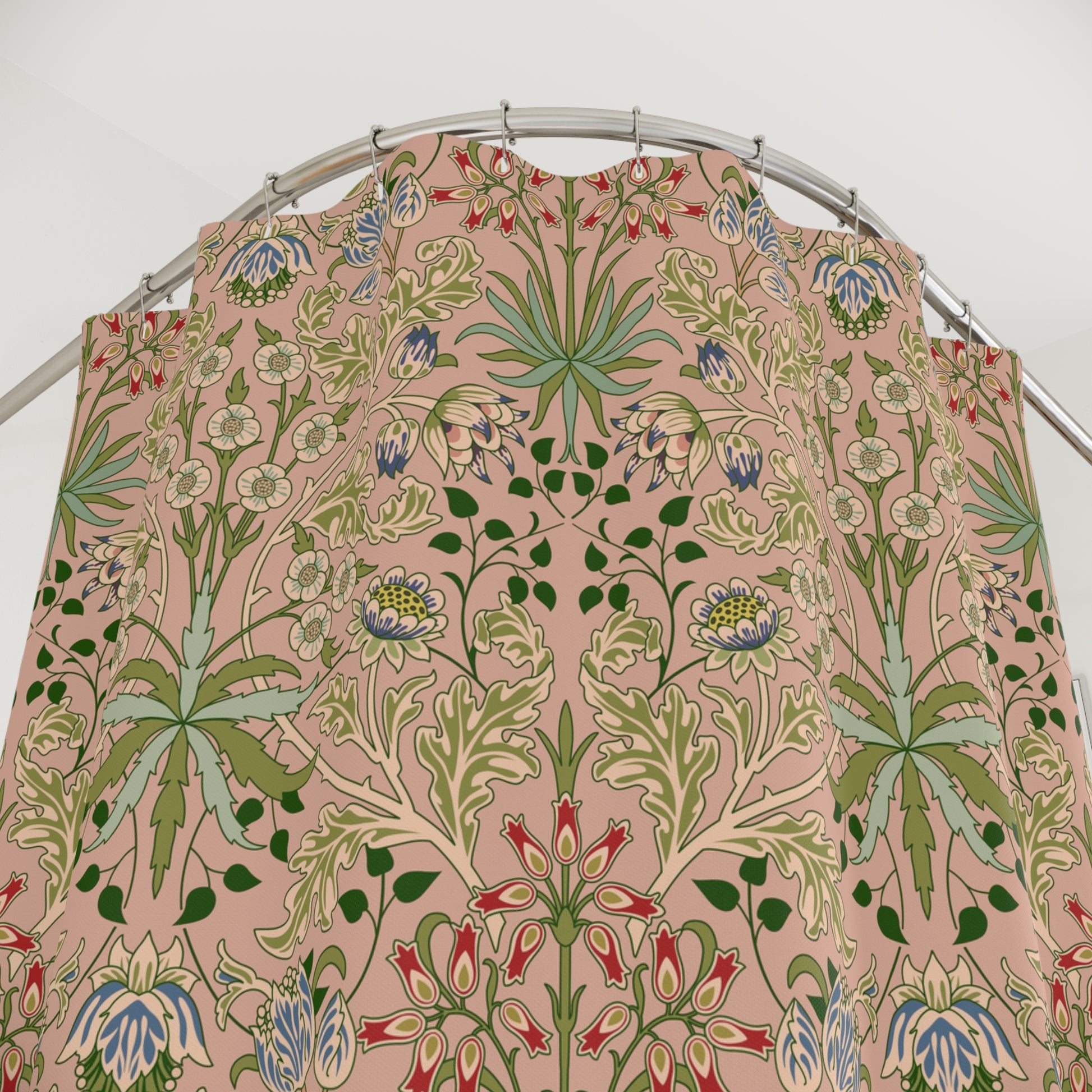 Floral patterned fabric on a metal rod against a white background