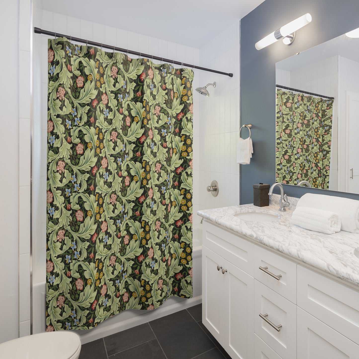 Bathroom with a floral-patterned shower curtain and white vanity.