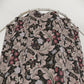 Floral patterned fabric on a hanger against a white background