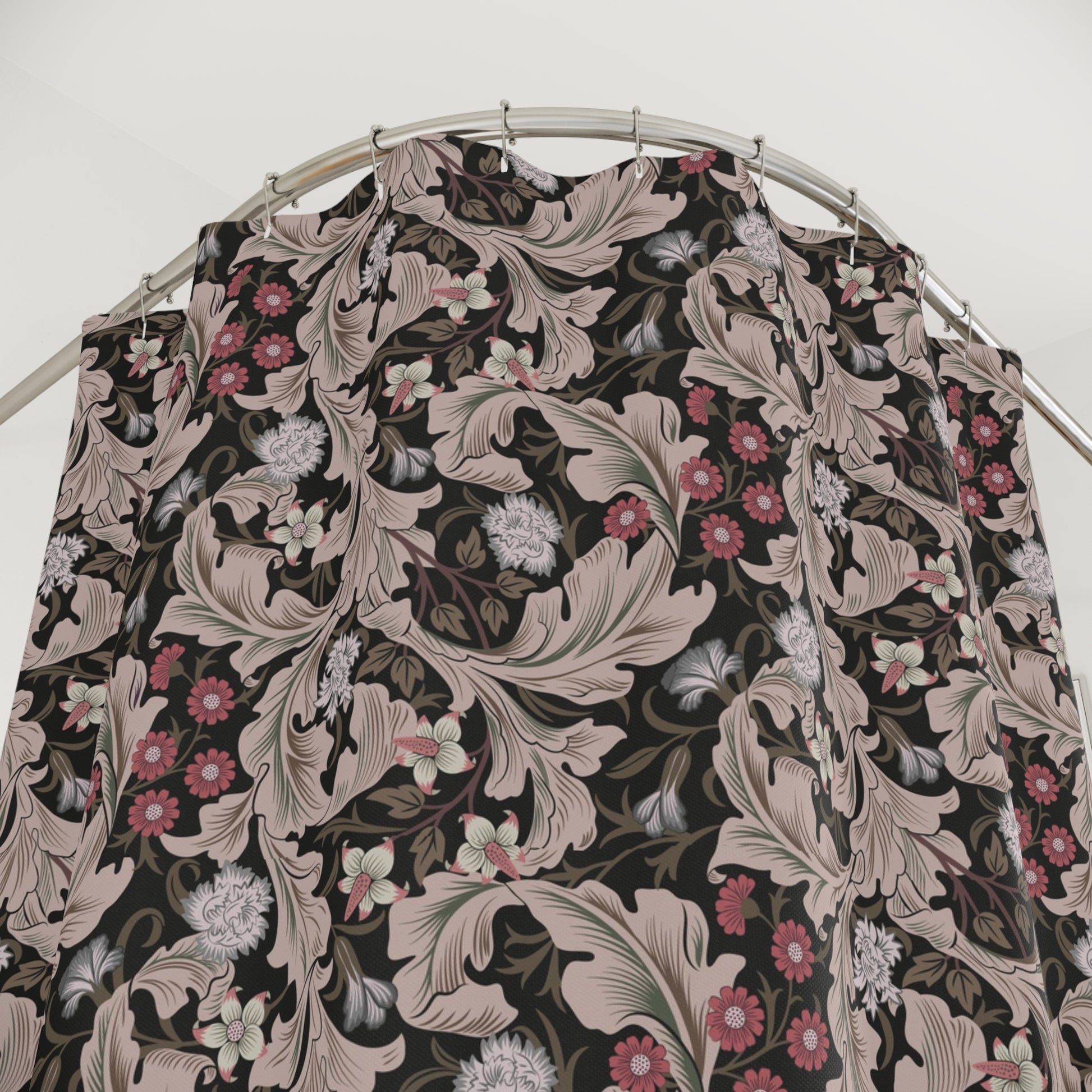 Floral patterned fabric on a hanger against a white background