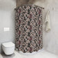 Bathroom with a patterned shower curtain and a white toilet.
