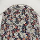 Floral patterned PVC shower curtain on a mannequin against a white background