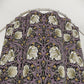 Floral patterned PVC shower curtain against a white background
