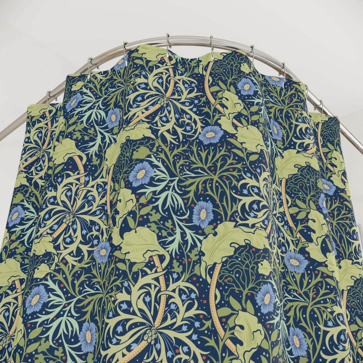 Floral patterned fabric on a metal hanger against a white background