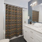 A shower curtain featuring a repeating William Morris & Co 'Strawberry Thief' pattern with birds and floral motifs on a dark background.