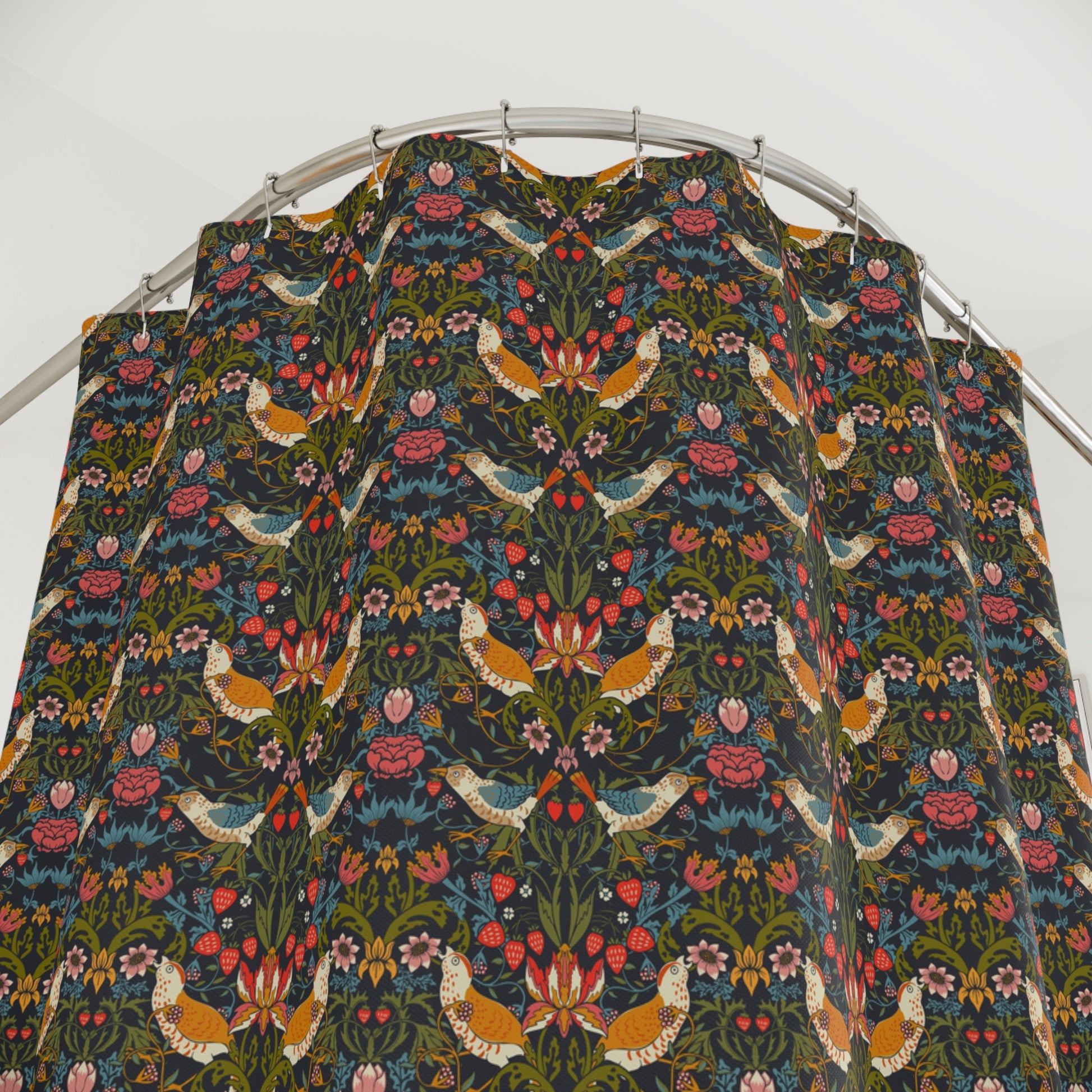 A shower curtain featuring a repeating William Morris & Co 'Strawberry Thief' pattern with birds and floral motifs on a dark background.