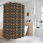 A shower curtain featuring a repeating William Morris & Co 'Strawberry Thief' pattern with birds and floral motifs on a dark background.