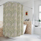 A shower curtain featuring a green floral pattern inspired by William Morris.
