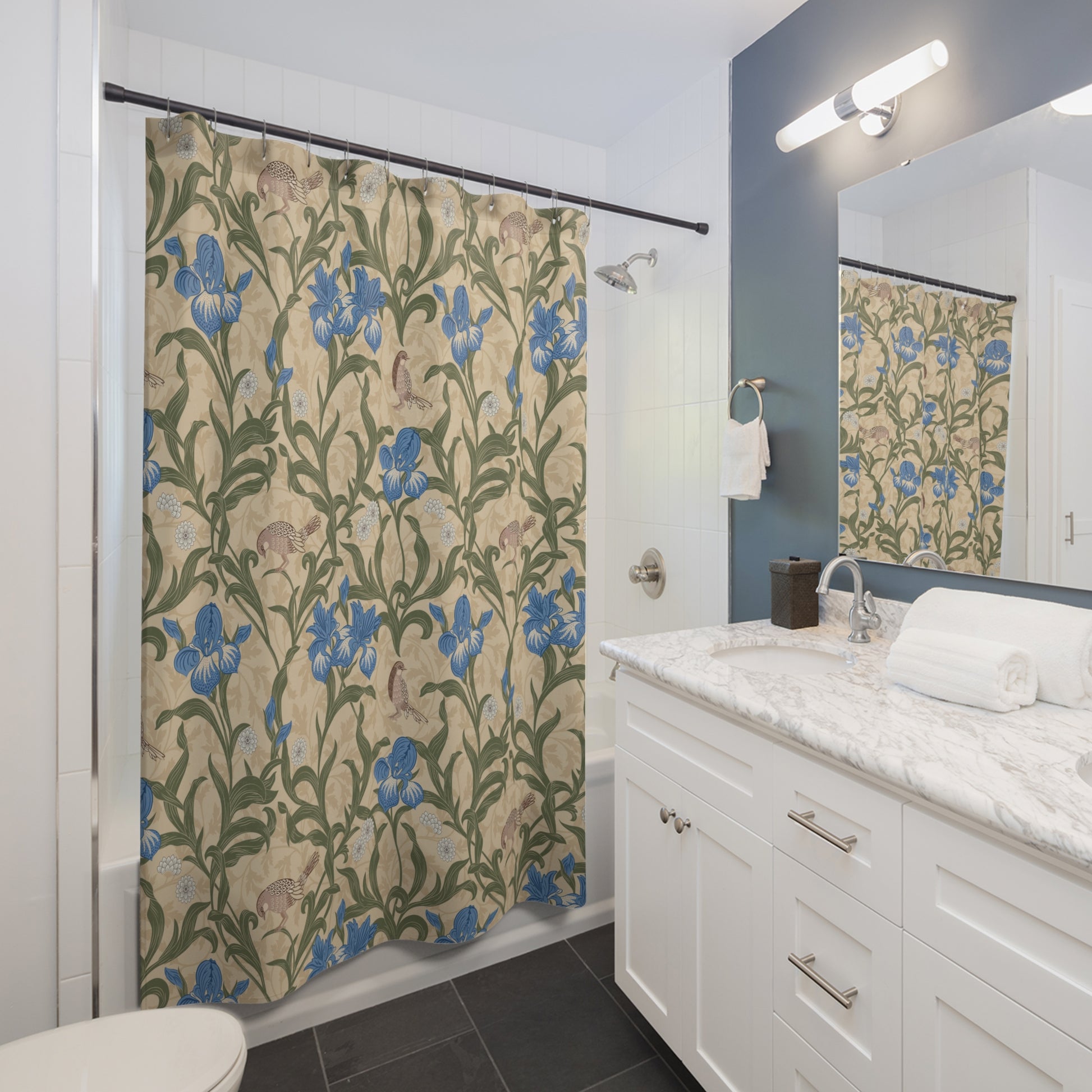 Bathroom with floral shower curtain, sink, and mirror.