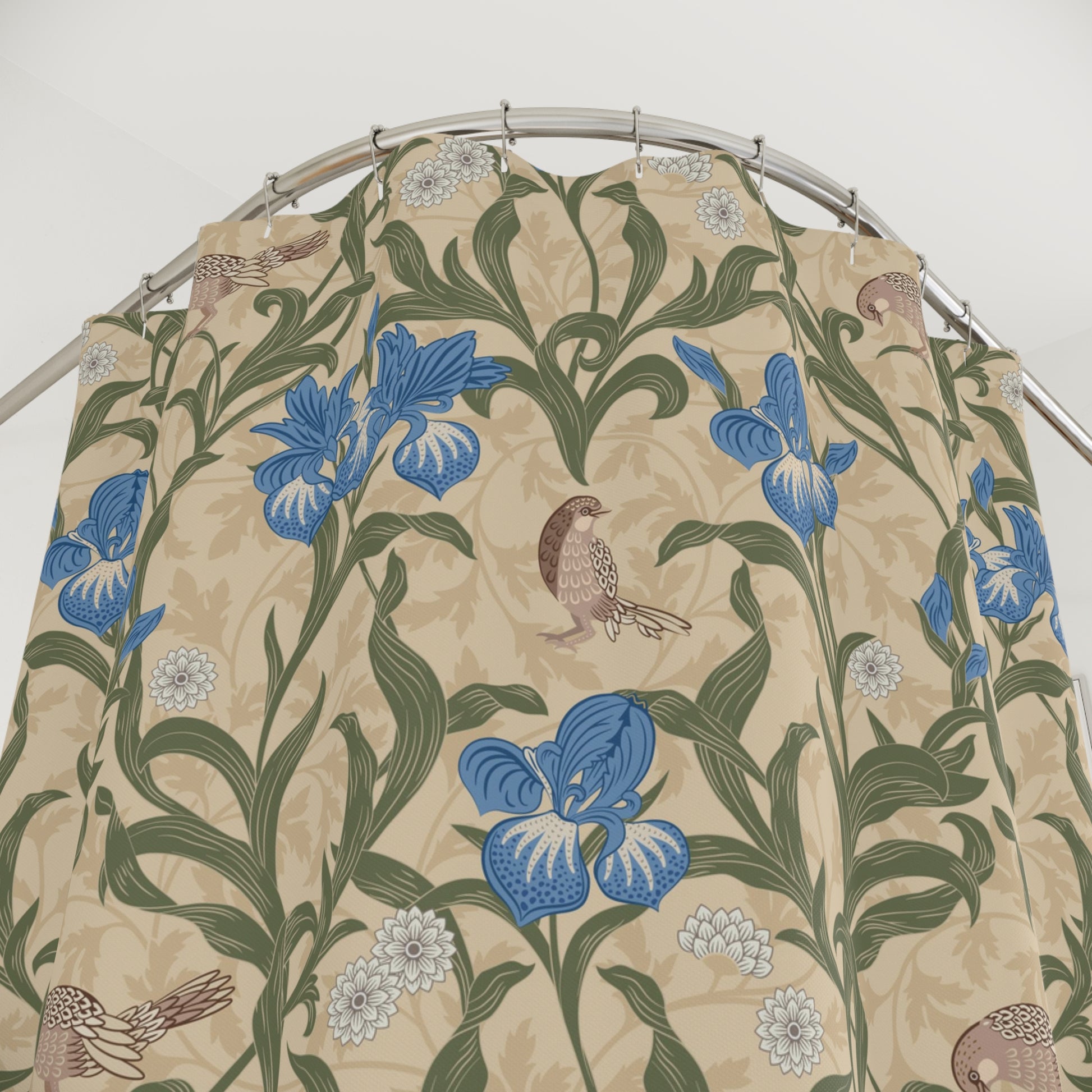 Floral and bird patterned fabric on a hanger against a white background