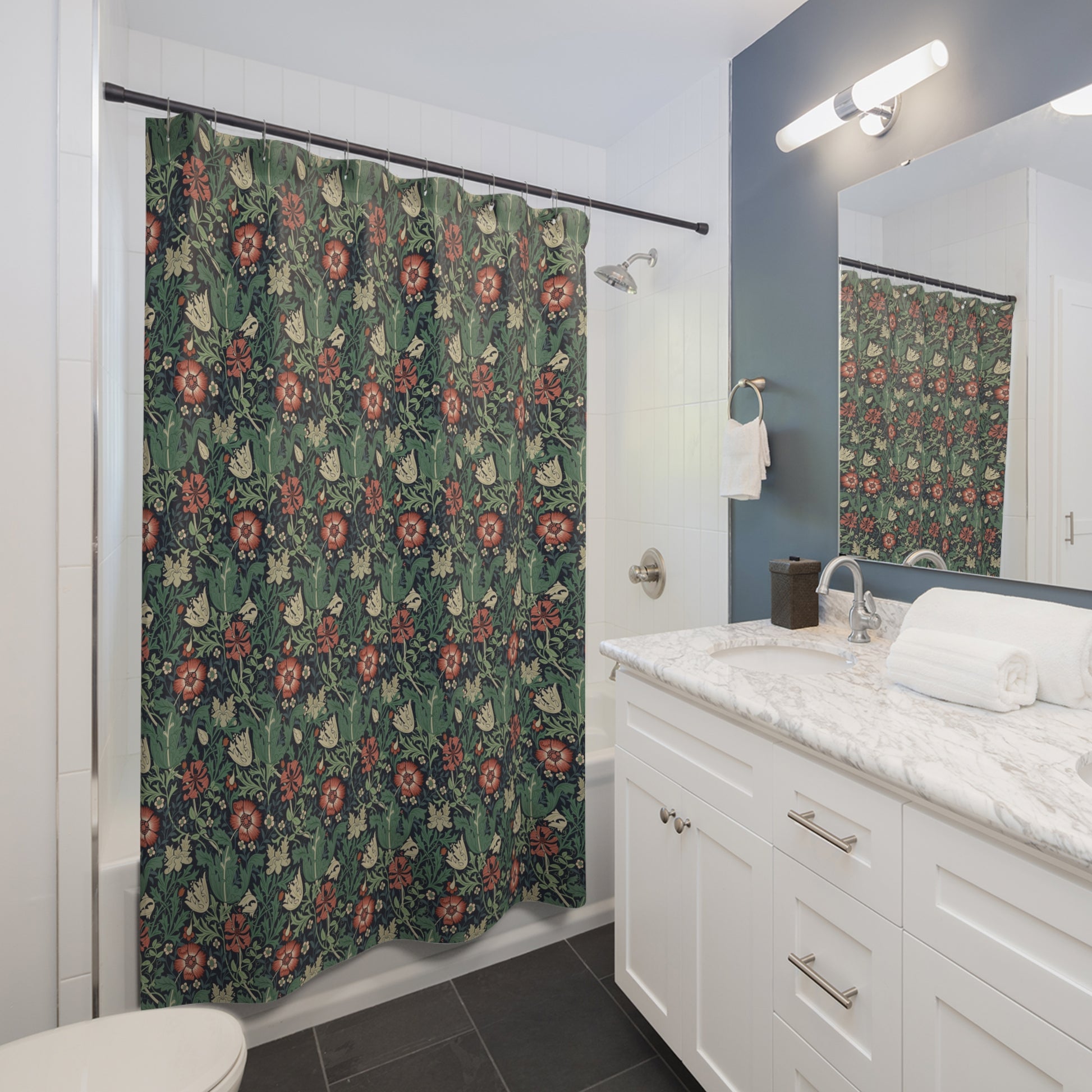 Bathroom with floral shower curtain, white vanity, and mirror.