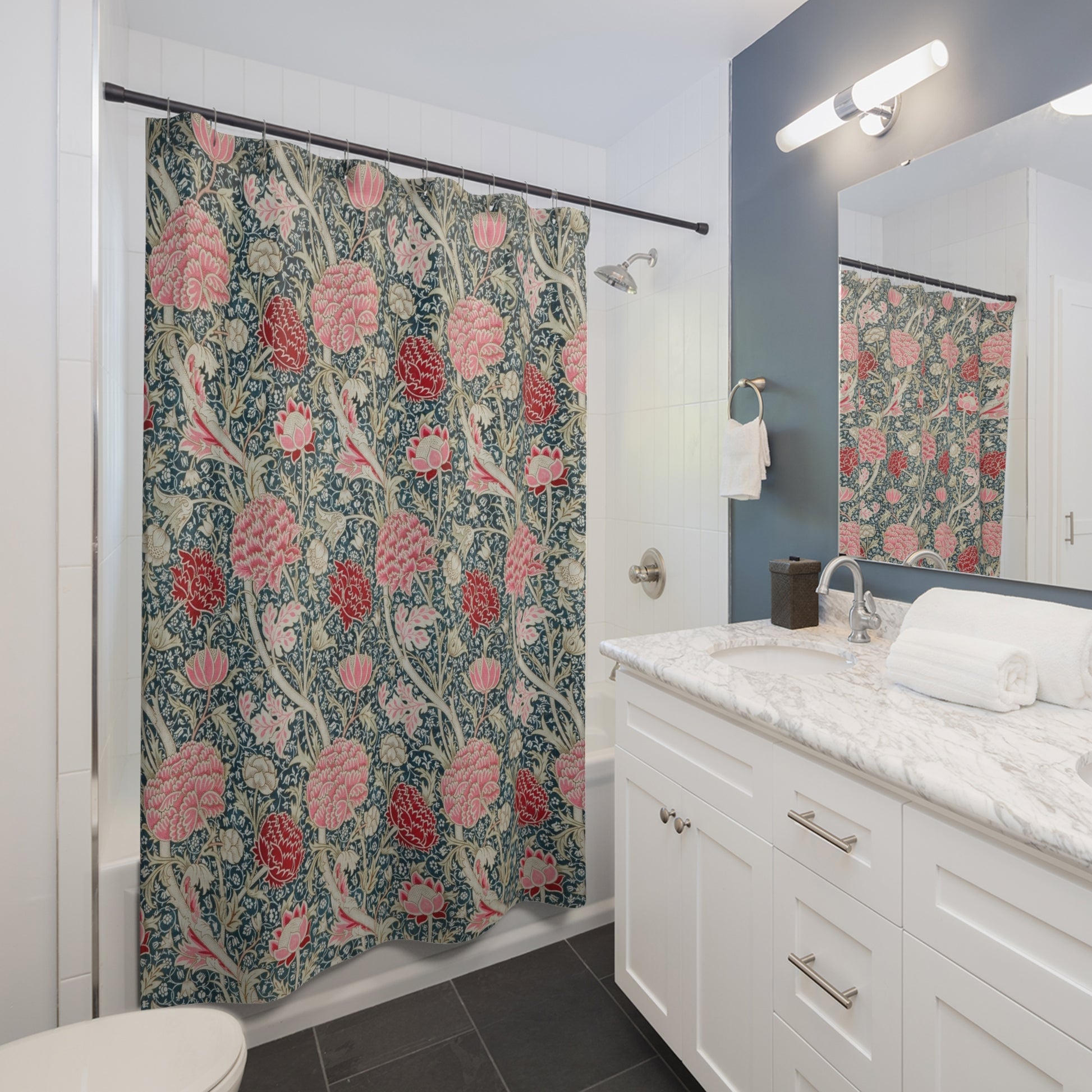 Bathroom with floral shower curtain, sink, and mirror.