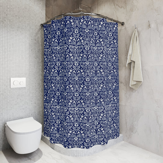 Blue floral shower curtain in a bathroom setting with a toilet and towel.