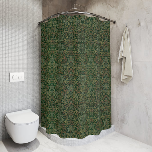 Bathroom with a green patterned shower curtain, white toilet, and beige towel.