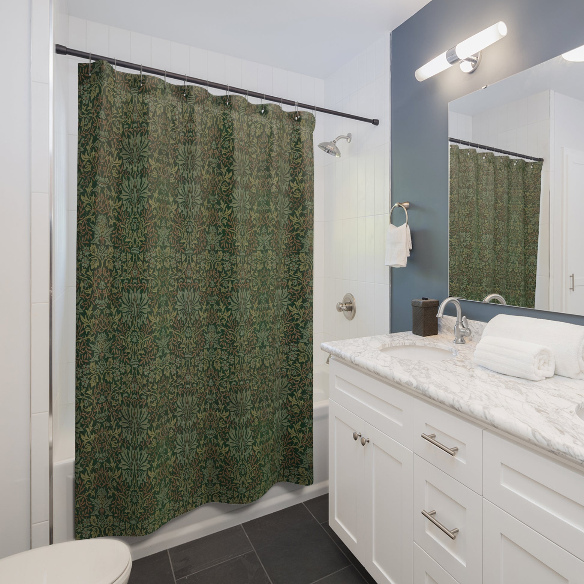 Bathroom with green patterned shower curtain, white vanity, and mirror.