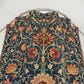 Decorative fabric with intricate floral pattern on a white background