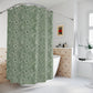 Green floral-patterned shower curtain in a bathroom setting