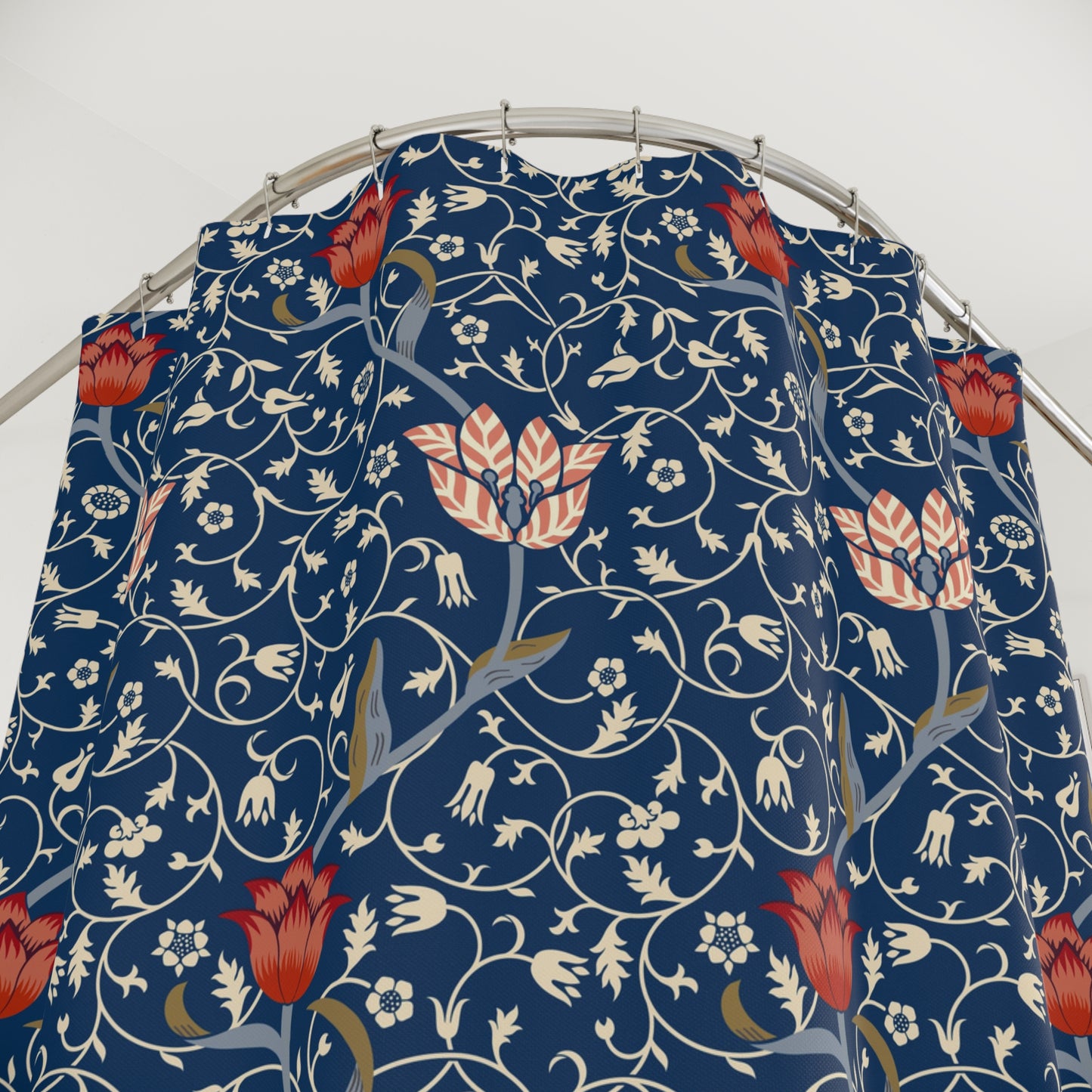 Floral patterned fabric on a metal hanger against a white background