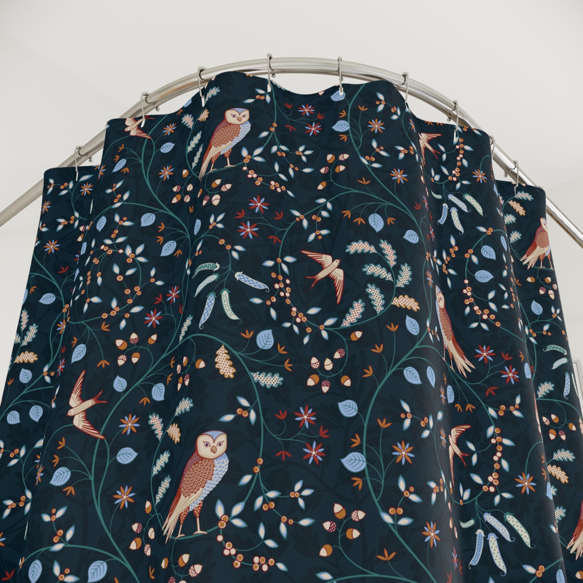 Dark blue fabric with bird and owl pattern on a metal rod