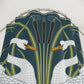Shower curtain with swan and plant design on a white background