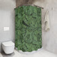 Bathroom with a floral-patterned shower curtain and a white toilet.