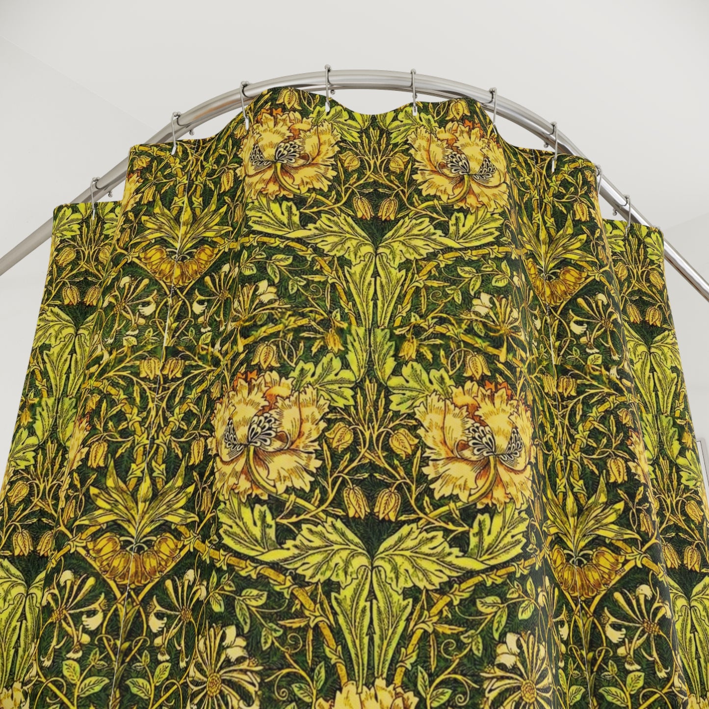 A shower curtain with a gold and green floral pattern inspired by the Victorian era and the art of William Morris.