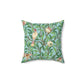 A square-shaped throw pillow with a Tiffany Blue floral background featuring a bird and pomegranate William Morris & Co pattern .