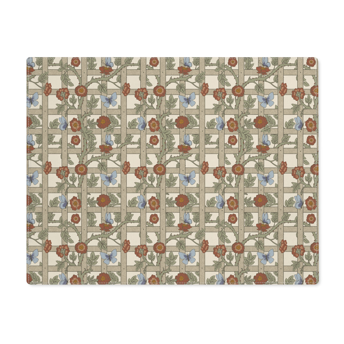 A rectangular placemat with a vintage Art Nouveau floral pattern featuring orange-red flowers, green leaves, and light blue butterflies on a beige and gray lattice background.
