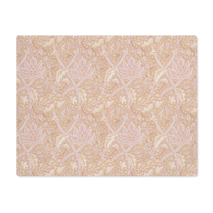 A rectangular cotton placemat with a floral pattern inspired by William Morris, primarily in pink tones.