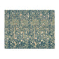 A rectangular placemat featuring a dense, vintage-style botanical and bird pattern in muted teal, beige, and soft pink tones, shown flat against a solid white background.