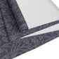 A smoky blue table runner with a William Morris & Co leaf pattern displayed on a dining table.