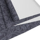 A smoky blue table runner with a William Morris & Co leaf pattern displayed on a dining table.