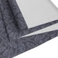 A smoky blue table runner with a William Morris & Co leaf pattern displayed on a dining table.