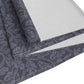 A smoky blue table runner with a William Morris & Co leaf pattern displayed on a dining table.