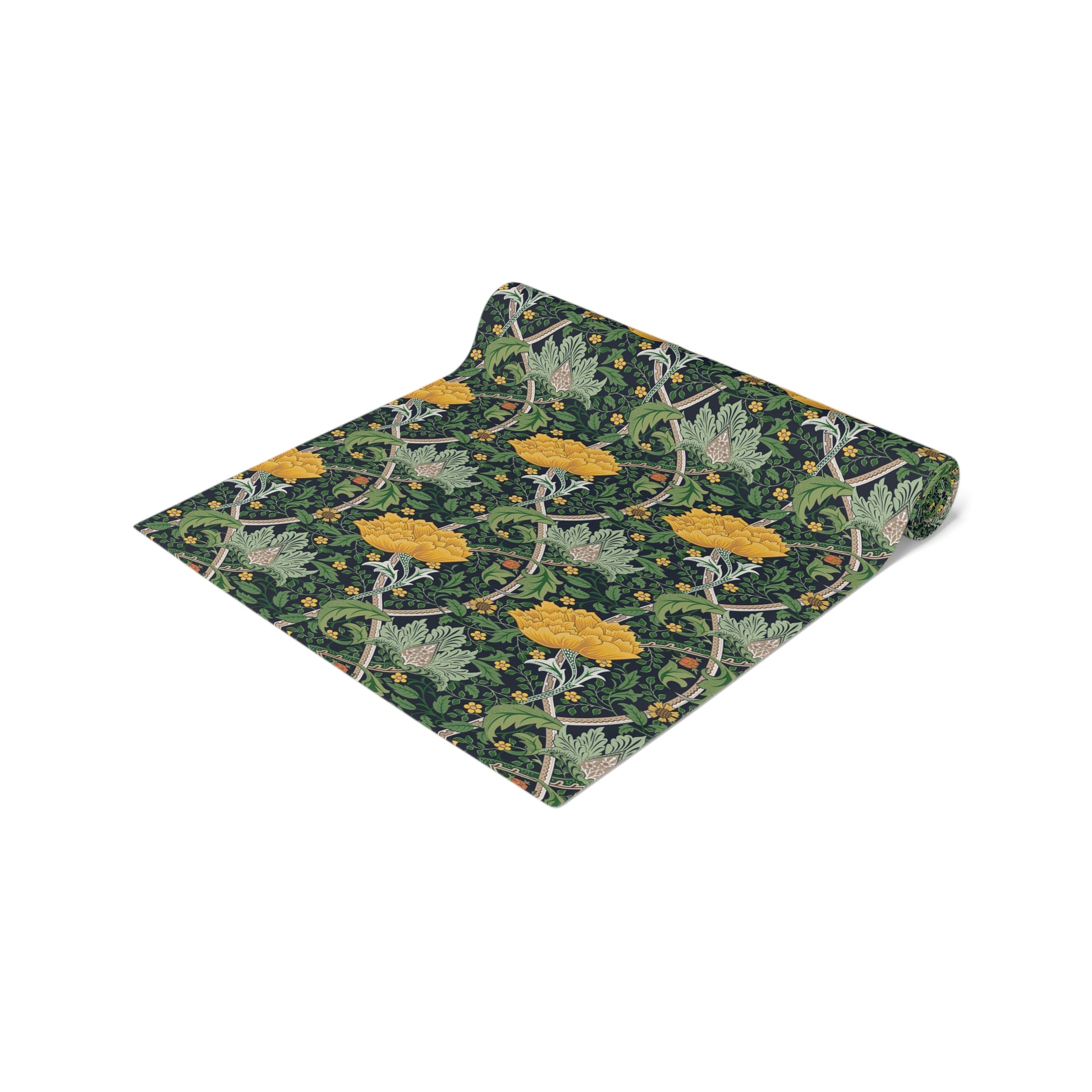 A yellow and green floral William Morris & Co patterned table runner with hemmed edges displayed on a dining table.