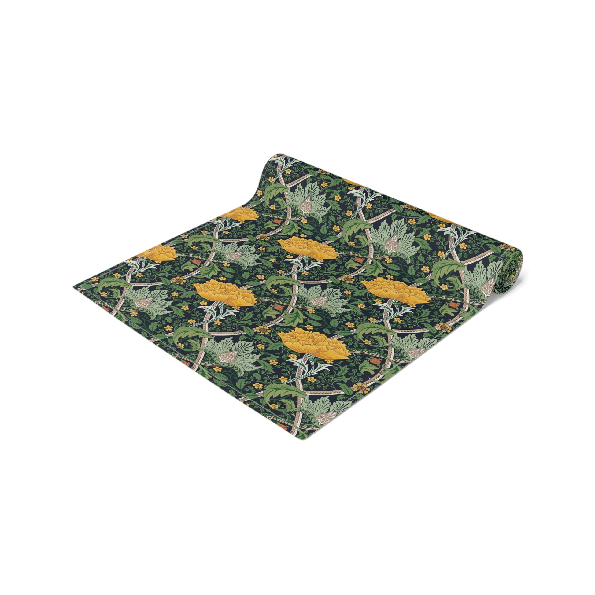 A yellow and green floral William Morris & Co patterned table runner with hemmed edges displayed on a dining table.